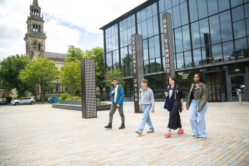 students walking in a group outside One Elmwood